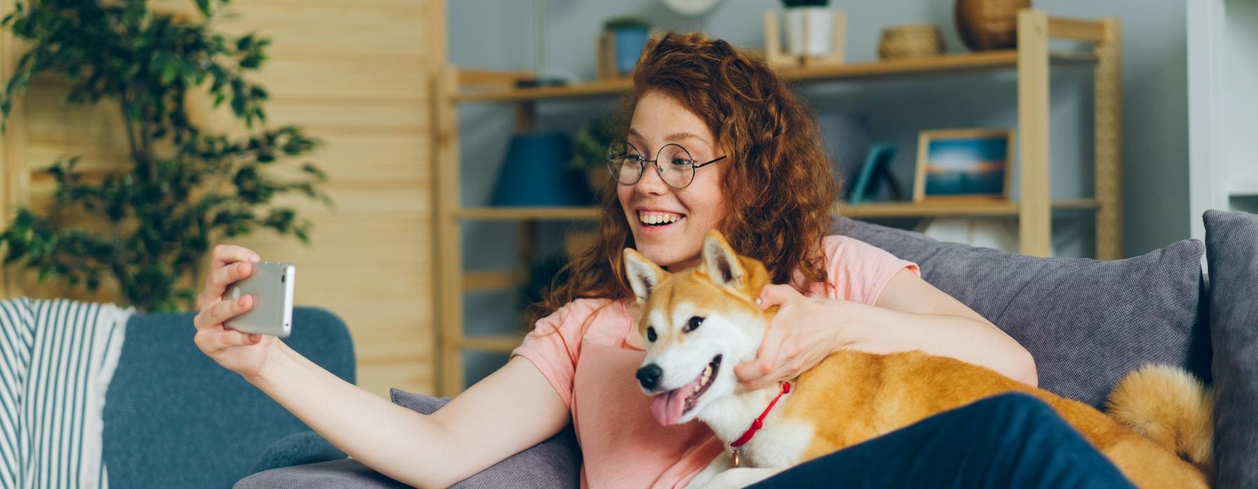 a woman holding a dog